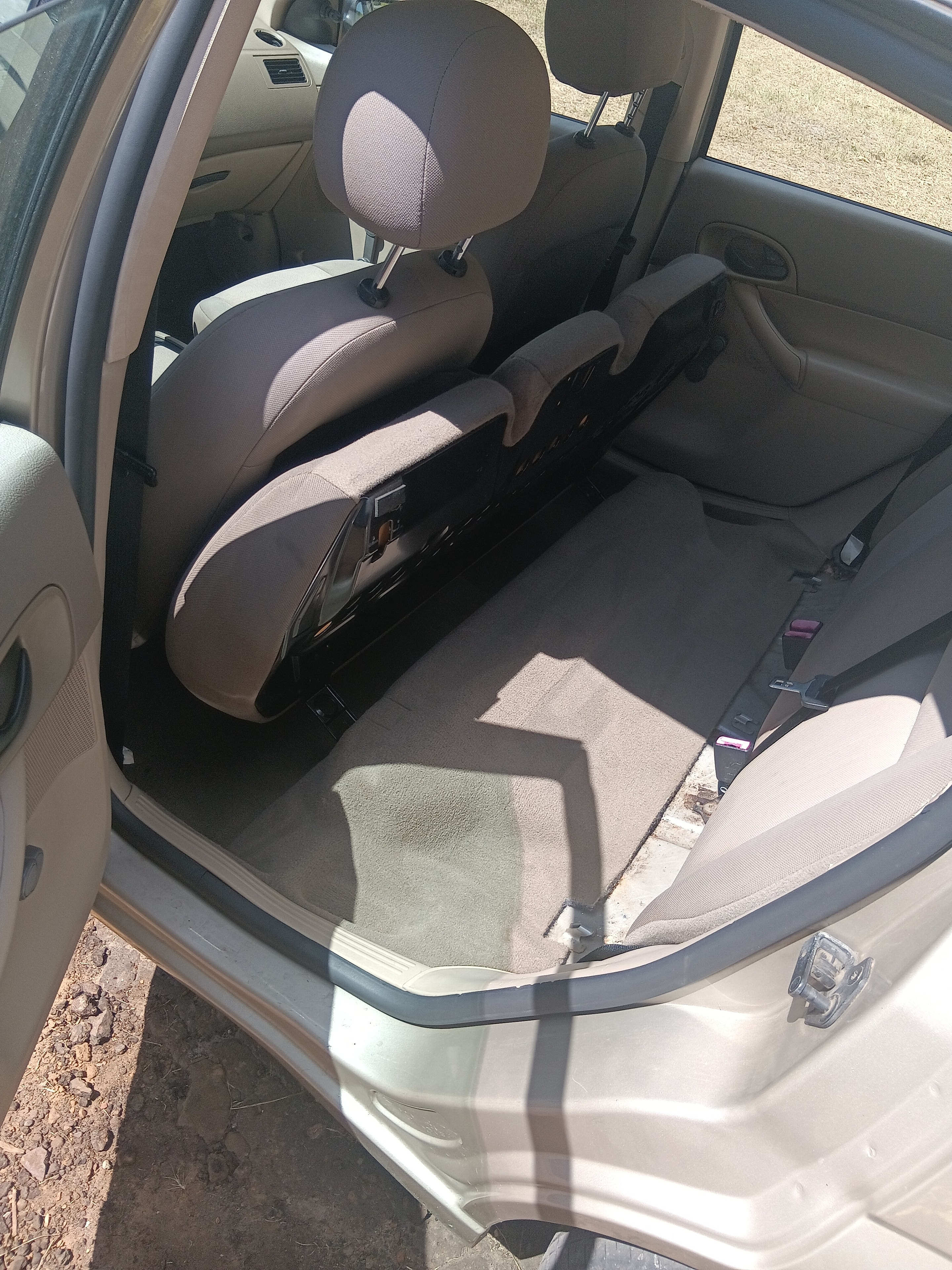 Tan Ford Focus center console after interior detailing