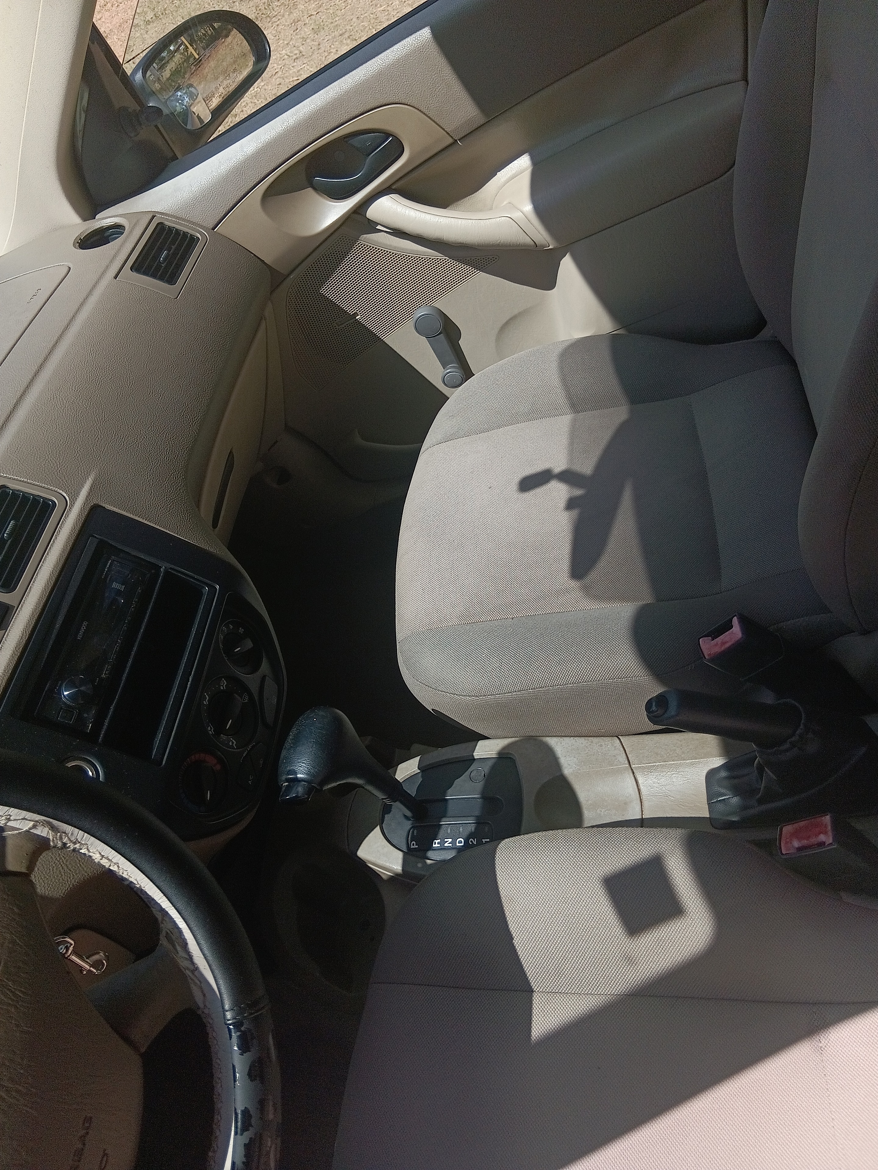 Tan Ford Focus front seats after interior detailing